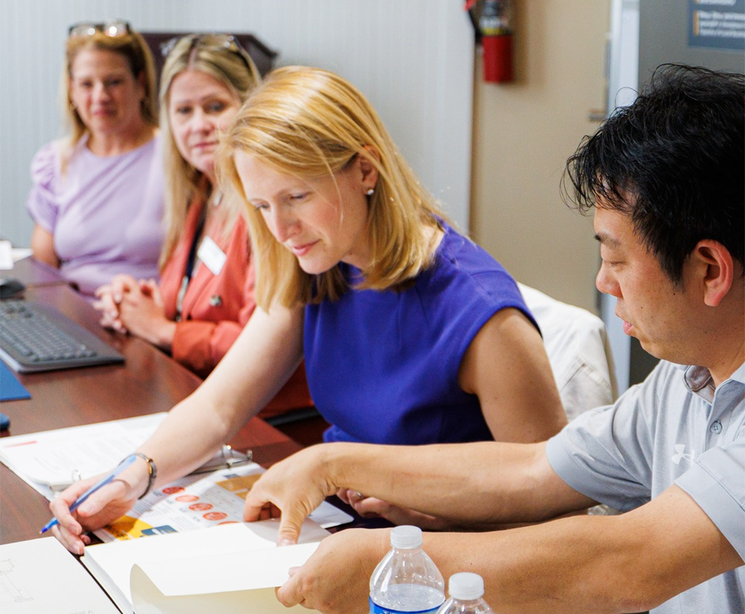 Comptroller Lierman looking at a book